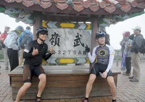 Bikers pose at the 3275-meter high peak of Mt. Wuling, the finish of the arduous KOM Race © 2015 Karen Rubin/news-photos-features.com