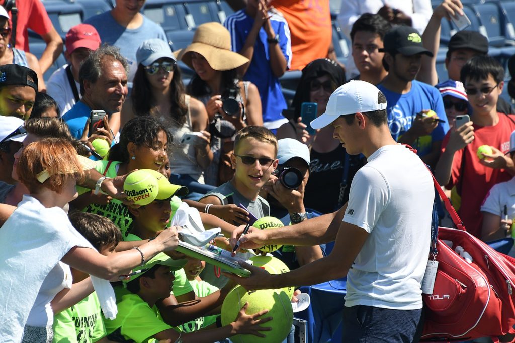 Fans flock to Milos Raonic after his practice in the Louis Armstrong Stadium; fans will get to say a final farewell to the stadium on Sept. 8 © 2016 Karen Rubin/news-photos-features.com