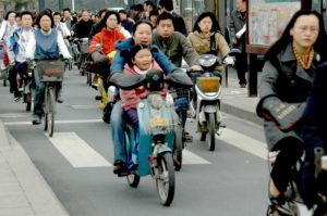 Braving the traffic: bikes and mopeds cram their lane on the streets of Hangzhou © 2016 Karen Rubin/goingplacesfarandnear.com