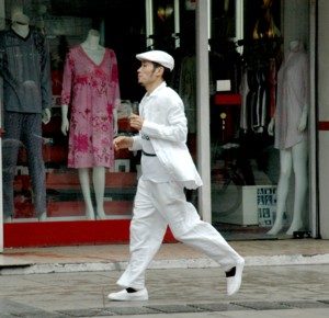 A fashionable man struts down Wulin Road, Hangzhou's 'Fashion Avenue.' The city manifests old & new © 2016 Karen Rubin/goingplacesfarandnear.com