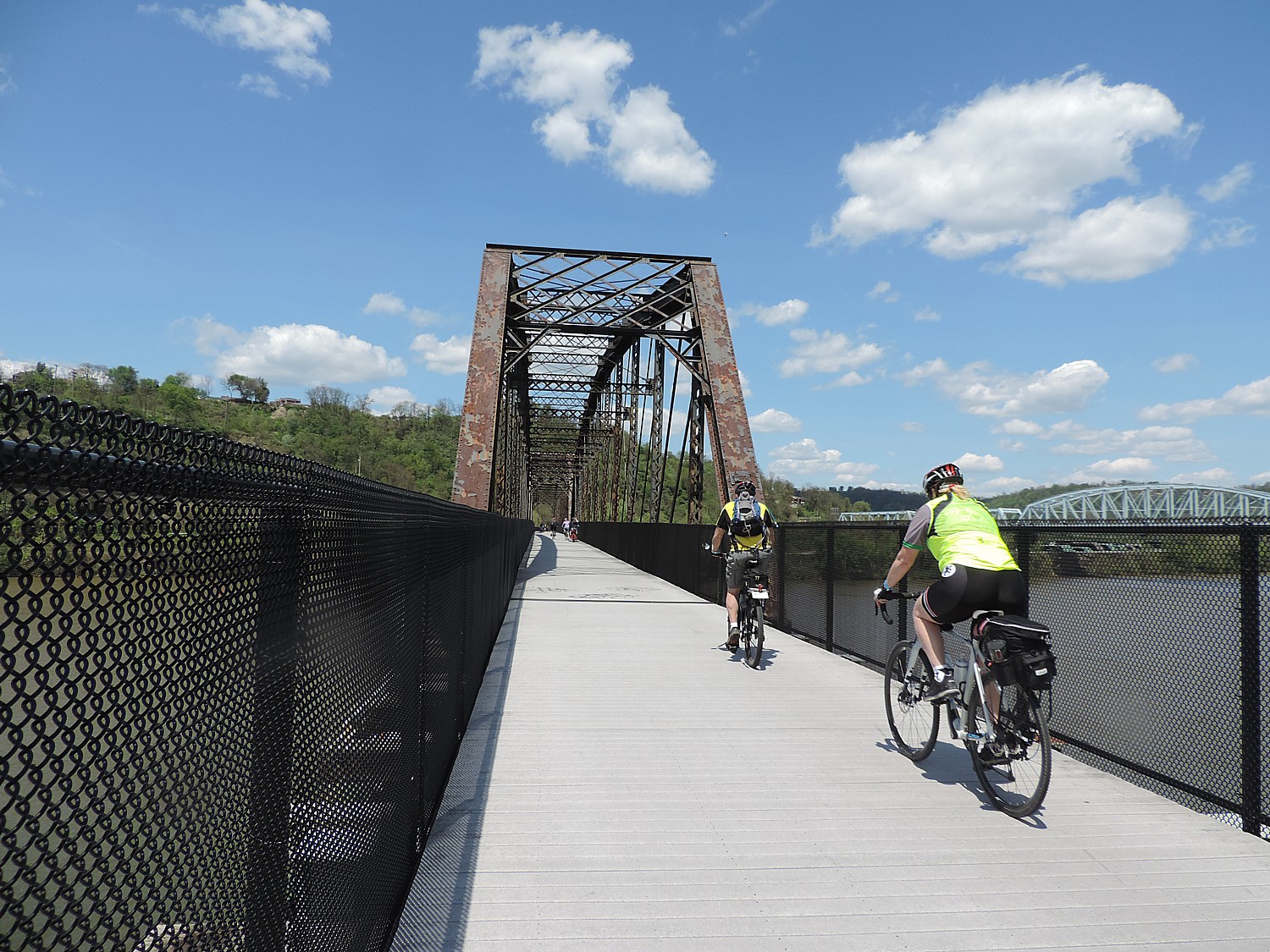 Riding over one of the rail bridges converted for biking use on the Great Allegheny Passage © 2016 Karen Rubin/goingplacesfarandnear.com