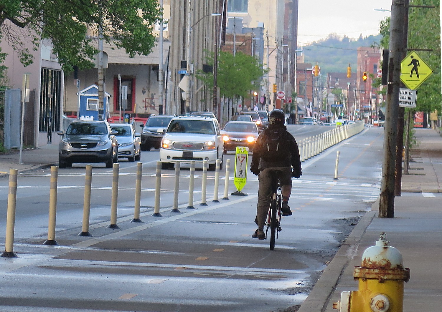 Biking on a dedicated lane in Pittsburgh © 2016 Karen Rubin/goingplacesfarandnear.com 