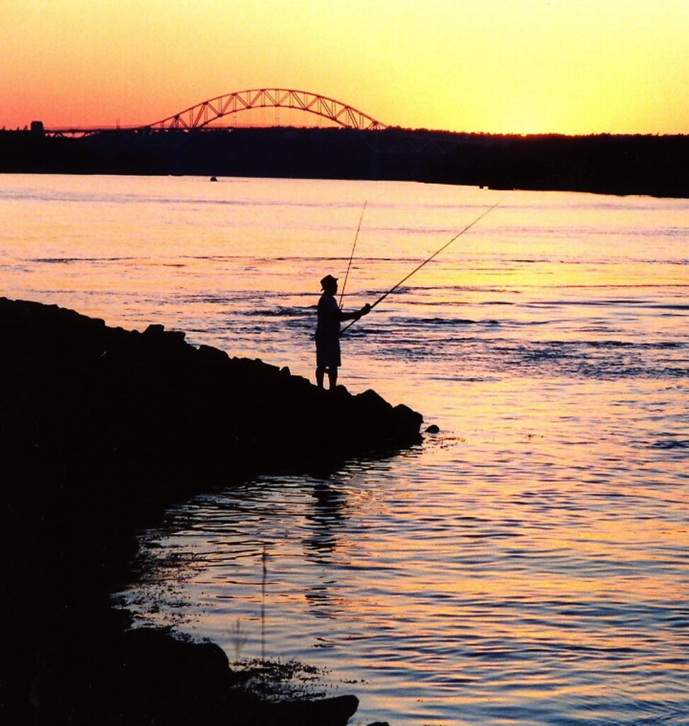 Fisherman fishing at the Cape Cod Canal, Sandwich, MA Stock Photo